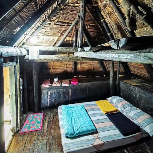 a room with a bunk bed in a house at Hiwang Native House Inn & Viewdeck in Banaue