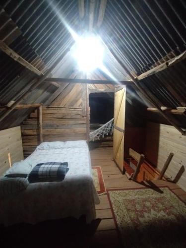 Ένα ή περισσότερα κρεβάτια σε δωμάτιο στο Pousada e Chalé da Cachoeira