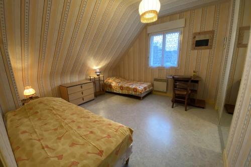 En eller flere senge i et værelse på Le Clos Brizeux