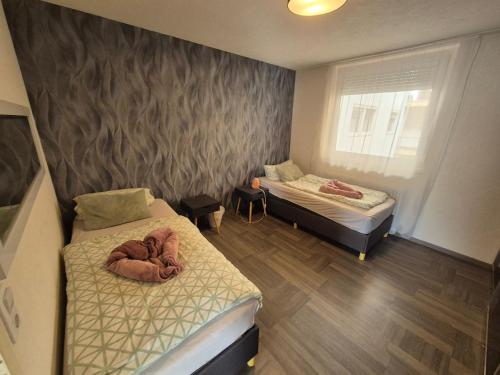 Postel nebo postele na pokoji v ubytování Xxl Monteurswohnung für 8 Personen