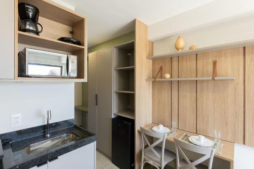 a kitchen with a sink and a counter top at Season Smart Flats by BLU stay in Porto De Galinhas