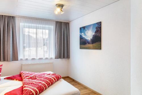 a bedroom with a bed and a window at Wohlfühlnest in Nauders