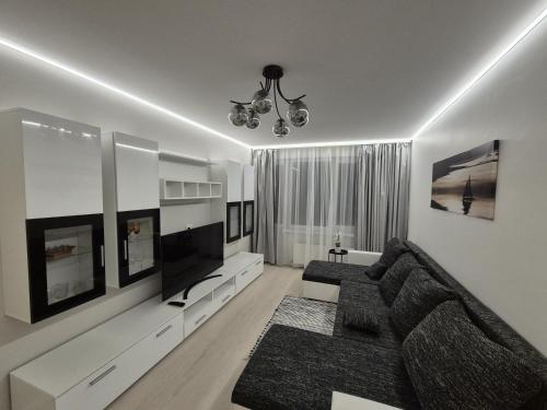 Μια τηλεόραση ή/και κέντρο ψυχαγωγίας στο Pilsētas sirds apartamenti