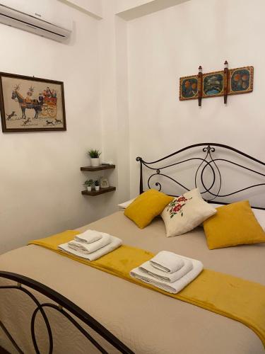 a bedroom with a bed with two towels on it at Casa Francesco in Forza dʼAgro