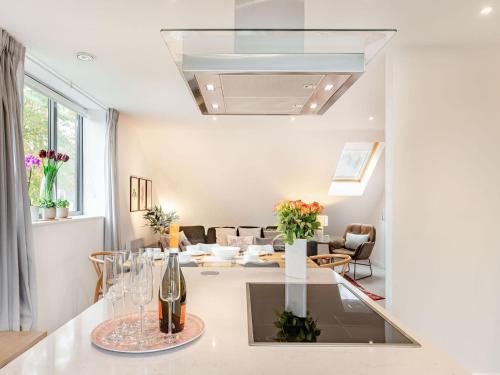 a living room with a table with wine glasses at The Loft At St John's in York
