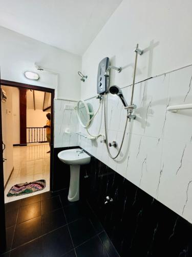 a bathroom with a toilet and a shower at Villa Happy Nest in Unawatuna