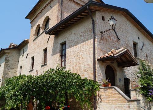 a large brick building with a street light on it at Residenza Rurale in Città di Castello