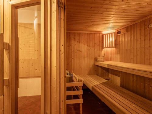 a sauna with wooden walls and benches in it at Duplex 4 pièces, 8 pers, animaux admis, cheminée - FR-1-263-155 in Valloire