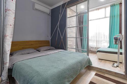 En eller flere senge i et værelse på В центре с дополнительным спальным местом