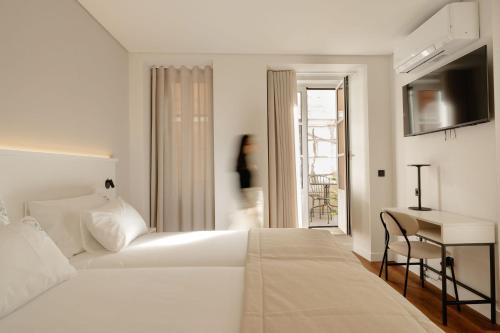 Кровать или кровати в номере Livô Boutique Living