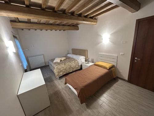 Postel nebo postele na pokoji v ubytování Il casale del Trebbio