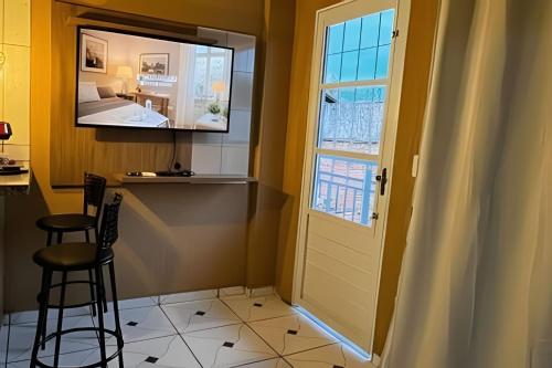 Cuisine ou kitchenette dans l'établissement Loft confortavel Prox Arena Pantanal