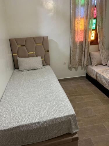 Voodi või voodid majutusasutuse Chambre Ez toas