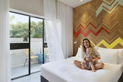 Postel nebo postele na pokoji v ubytování Cucu Hotel