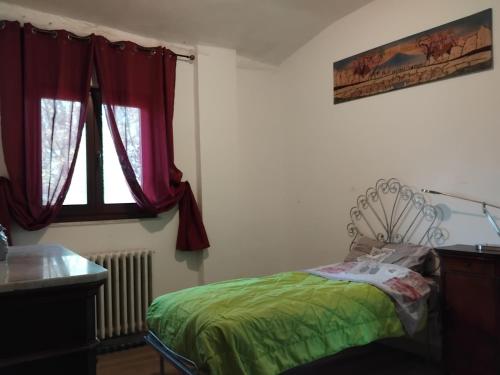 Ένα ή περισσότερα κρεβάτια σε δωμάτιο στο Aspettando Godot