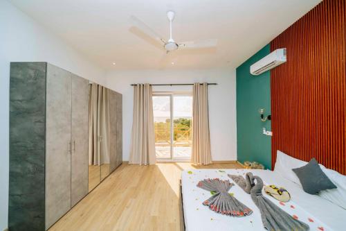 Giường trong phòng chung tại Sunset Villa Kidoti