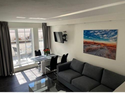 Televiisor ja/või meelelahutuskeskus majutusasutuses Seaside-Amrum-1