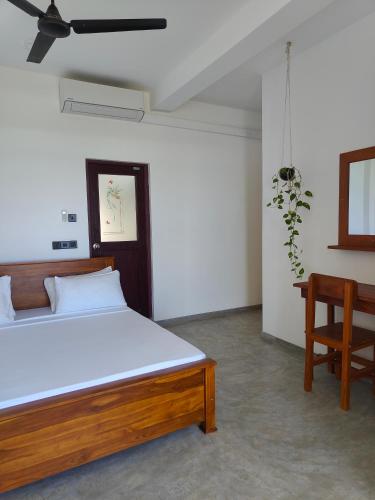 Ένα ή περισσότερα κρεβάτια σε δωμάτιο στο The Sun Set