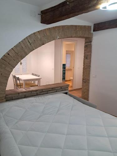 Postel nebo postele na pokoji v ubytování La casetta dell'amore di Mimmi