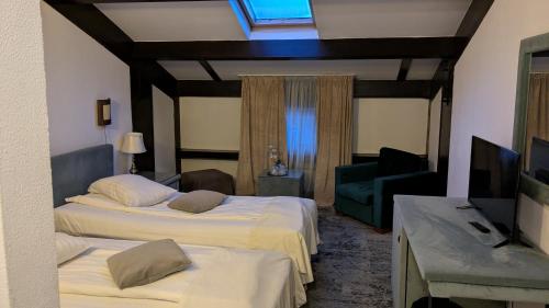 Postel nebo postele na pokoji v ubytování Hotel Regina