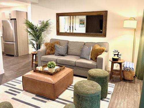 a living room with a couch and a table at Granite Ridge Condo by Revelstoke Vacations in Revelstoke