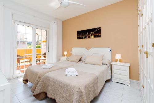 Una cama o camas en una habitación de Apto 1 Almoraide Suites