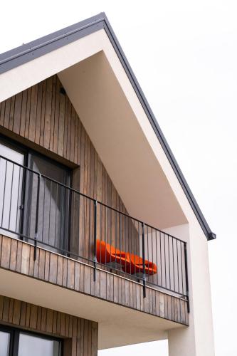 an orange object on a balcony of a house at Hiša ob stolpu in Lendava