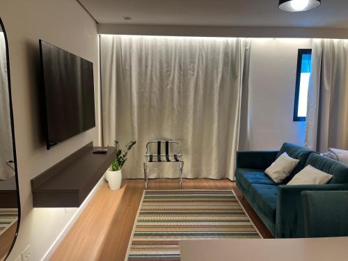 Un lugar para sentarse en ArqSuites Nações Unidas TransExpo - Novo quarto privado dentro do Hotel