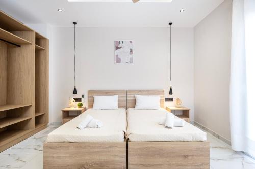 Postel nebo postele na pokoji v ubytování The Neptunian Suite Residence