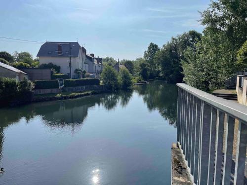 a view of a river from a bridge at 2-room apartment near Marais and CV in Bourges