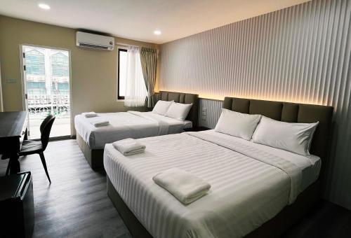 Postel nebo postele na pokoji v ubytování Excel Hotel Bangkok former Sri Krungthep Hotel