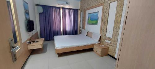 Μια τηλεόραση ή/και κέντρο ψυχαγωγίας στο Hotel O Phoenix Ac Rooms