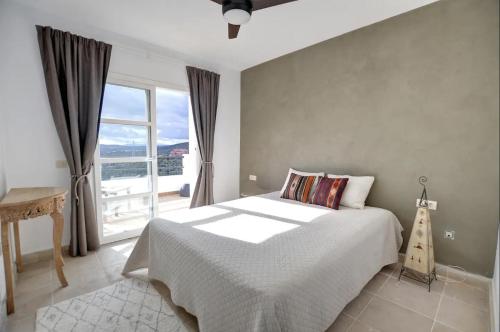 Postel nebo postele na pokoji v ubytování Casa Maria Luisa