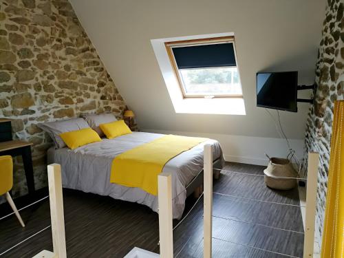 Postel nebo postele na pokoji v ubytování Gite Des Ajoncs