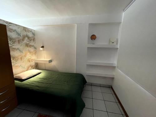 En eller flere senge i et værelse på Céntrico, acogedor