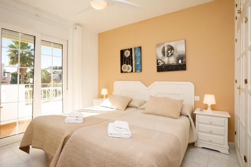 Postel nebo postele na pokoji v ubytování Apto 5 Almoraide Suites