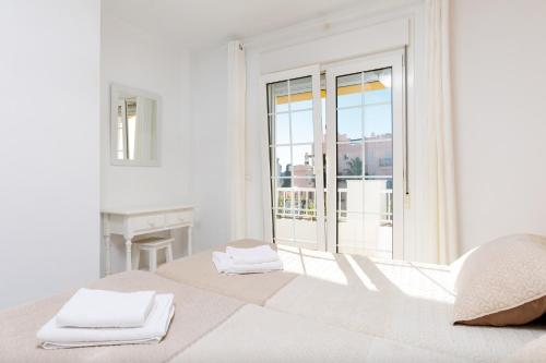 Postel nebo postele na pokoji v ubytování Apto 5 Almoraide Suites