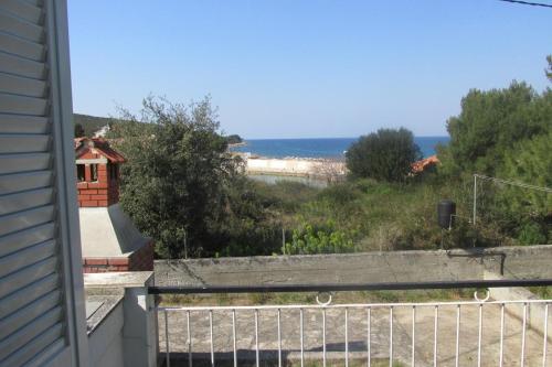 a view of the ocean from the balcony of a house at Holiday House in Sušica