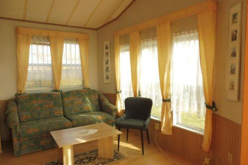 Posezení v ubytování Ferienhaus Mit Pool