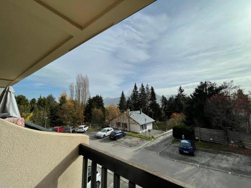 a balcony with a view of a parking lot at Studio accueillant avec vue montagne à Font-Romeu in Font-Romeu