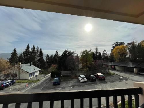 a view of a parking lot with cars parked at Studio accueillant avec vue montagne à Font-Romeu in Font-Romeu