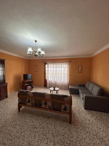 a living room with a couch and a table at Casa grande en Garachico centro in Garachico