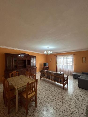 a living room with a table and a couch at Casa grande en Garachico centro in Garachico