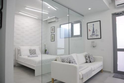 Ένα ή περισσότερα κρεβάτια σε δωμάτιο στο Luxe Condado Condo Terrace