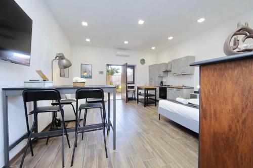 Giường trong phòng chung tại A Casa di Stefano by Domus&Dimore