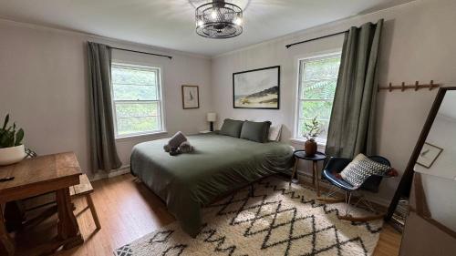 Postel nebo postele na pokoji v ubytování Harbert Hideaway