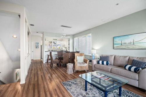 a living room with a couch and a table at Cedars East #822 in Longboat Key