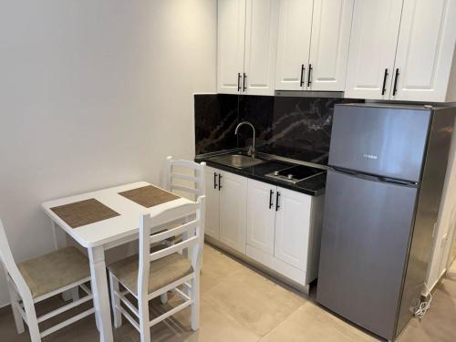 Kuchyň nebo kuchyňský kout v ubytování Shengjin apartaments