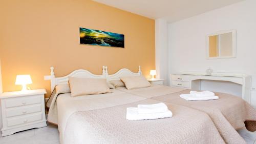 Postel nebo postele na pokoji v ubytování Apto 8 Almoraide Suites