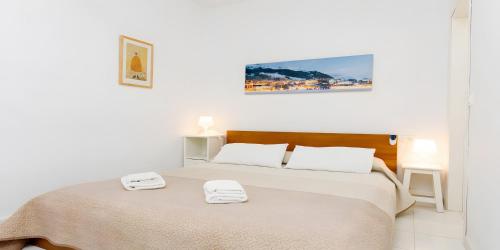 Postel nebo postele na pokoji v ubytování Apto B-A almoraide suites